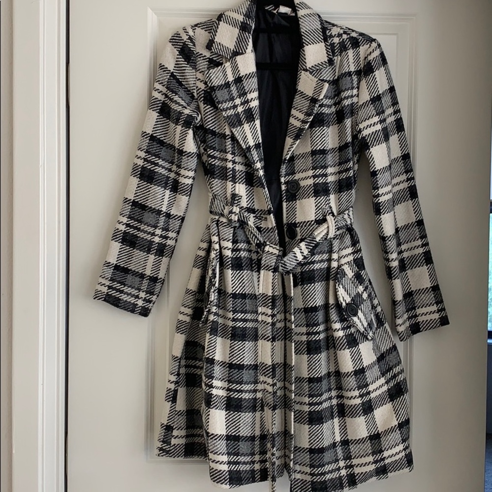 Black, white, and grey winter coat